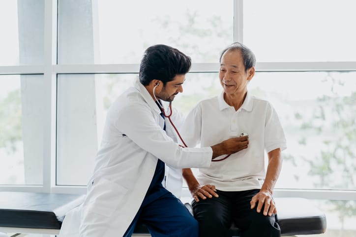 Photo shows doctor examining patient