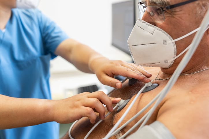 Photo shows man receiving EKG