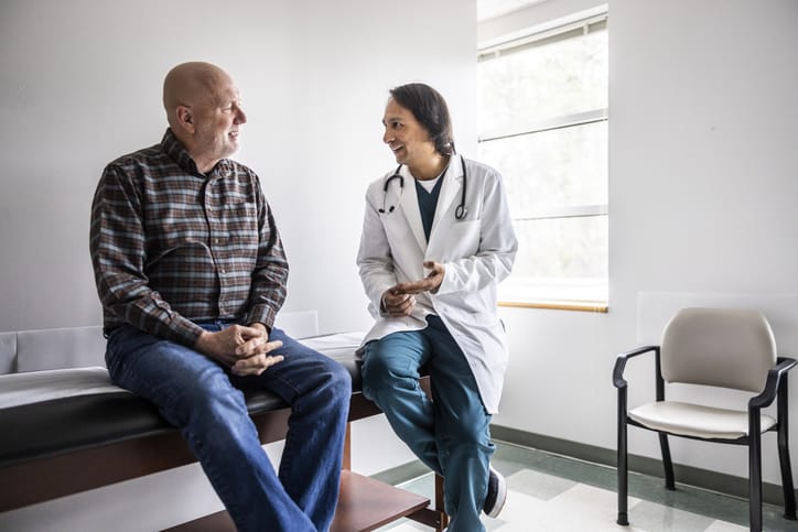 Photo shows doctor discussing treatment