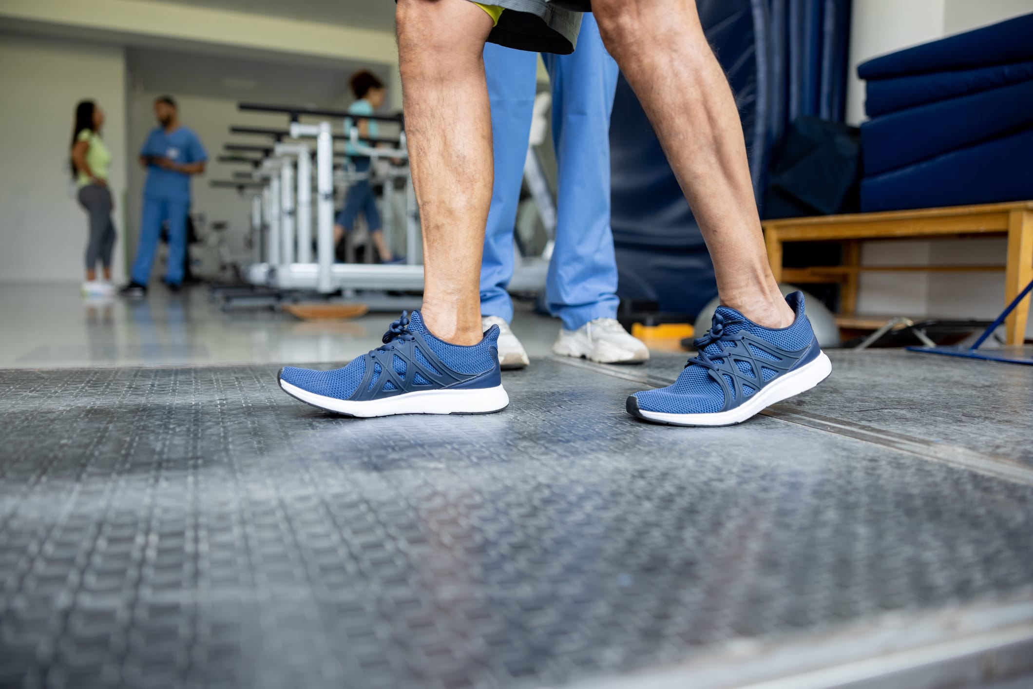 Close up of an older man performing a walking test