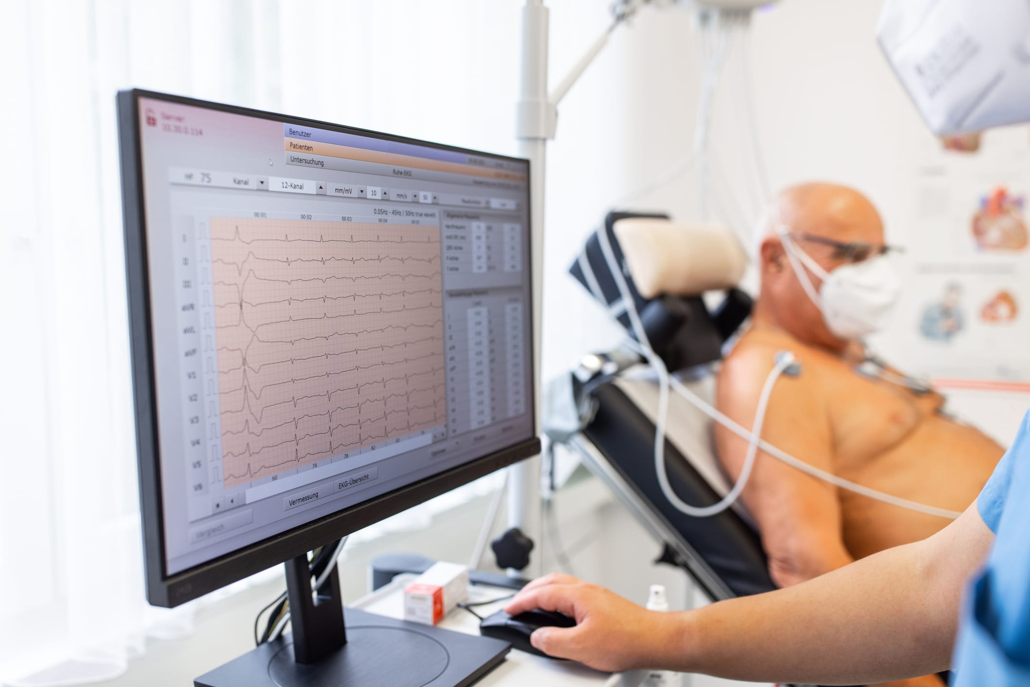 Older man getting EKG test