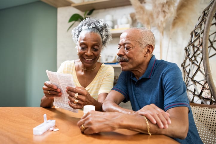 Senior adult taking medication