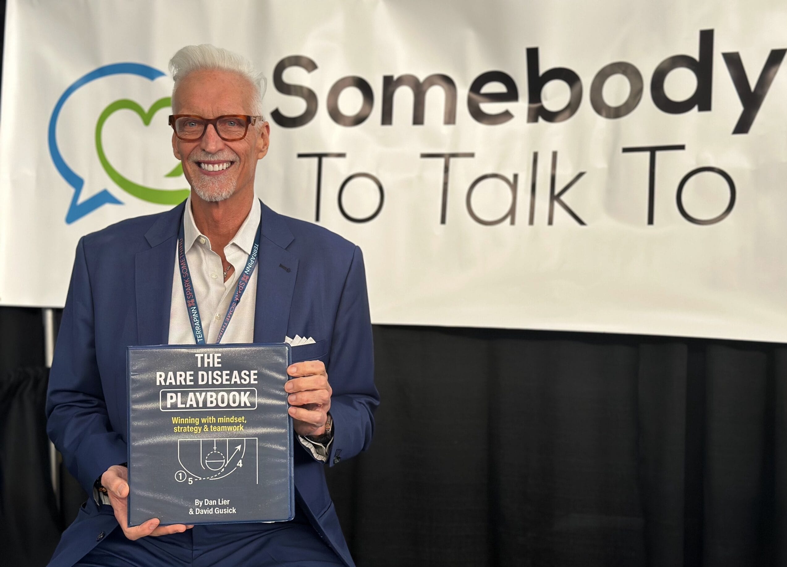 Dan Lier holding a copy of the 