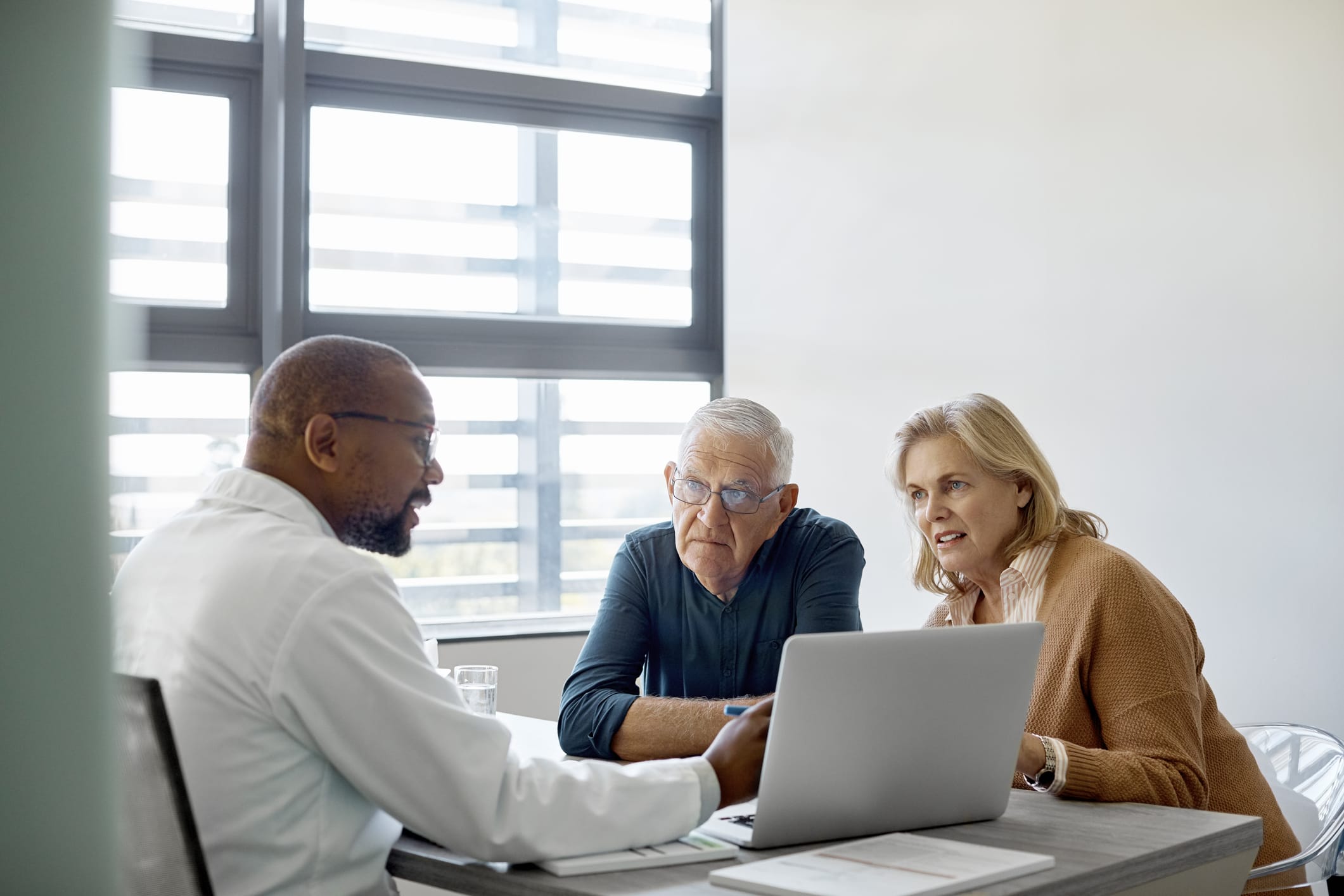 Elderly man and woman are listening to medical expertise.