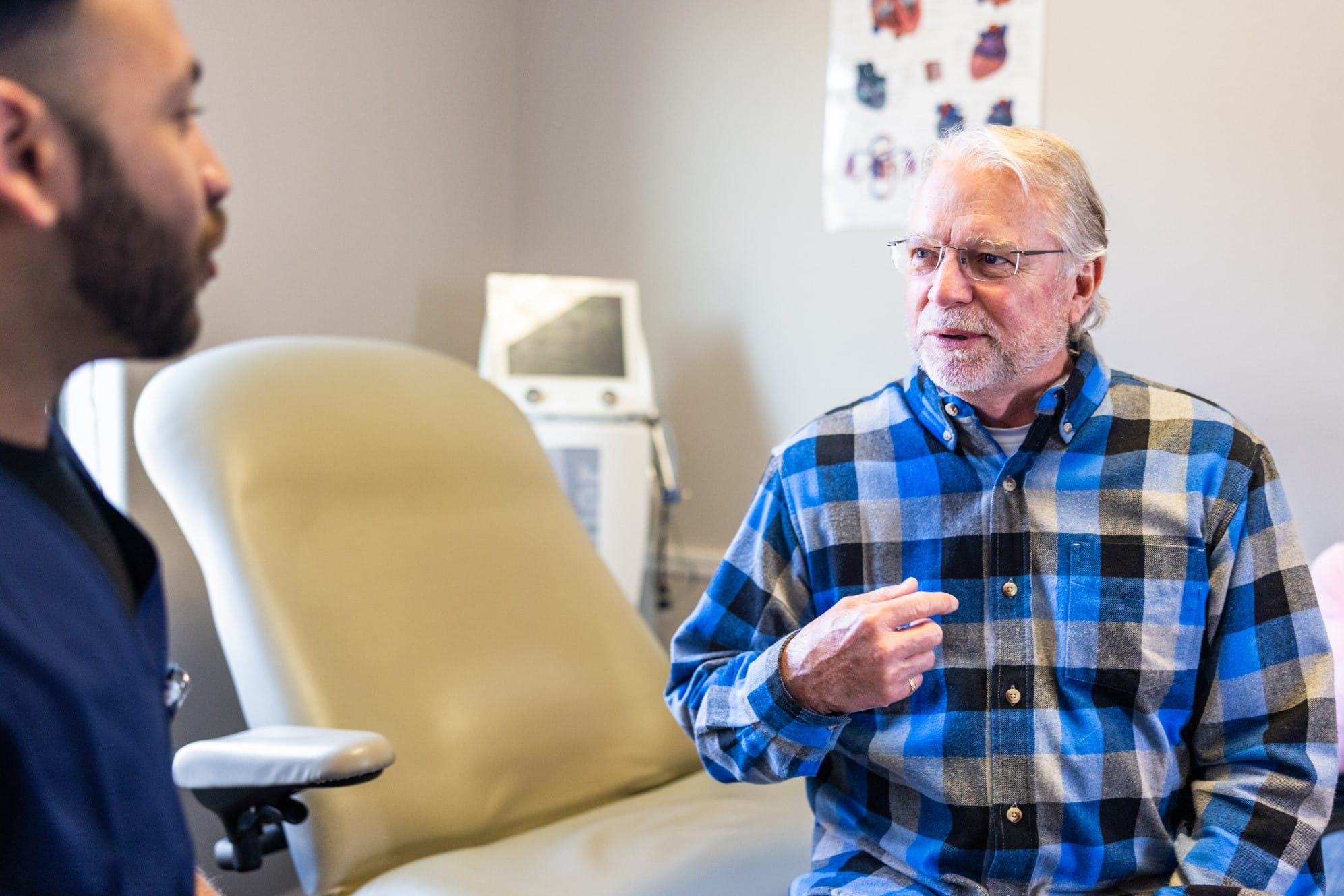 Older man speaking to health care provider