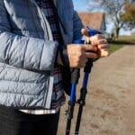 Man holding set of hiking poles