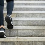 woman walking up stairs